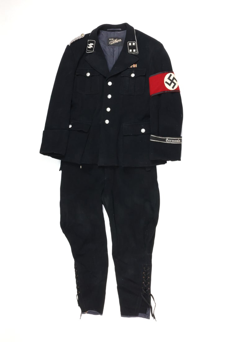 Post WWII German ALLGEMEINE SS Black Service Uniform Tunic & Trousers: Heavy black wool service tunic features double runic collar tab, four pip captain rank collar tab framed with silver cord, red arm band and embroidered cuff band reading Germany. Interior collar bears