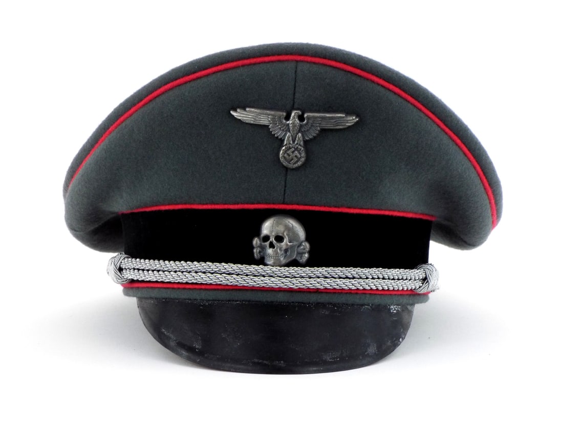 Very Good Quality German Made Post WWII SS PANZER Visor Cap Silver with Officer Chin Cord: Visor cap body of field grey wool exhibiting light surface nap wear and minor fading. Crown and black velvet band feature rose pink piping for Panzer armored personnel, displaying sound stitching thro