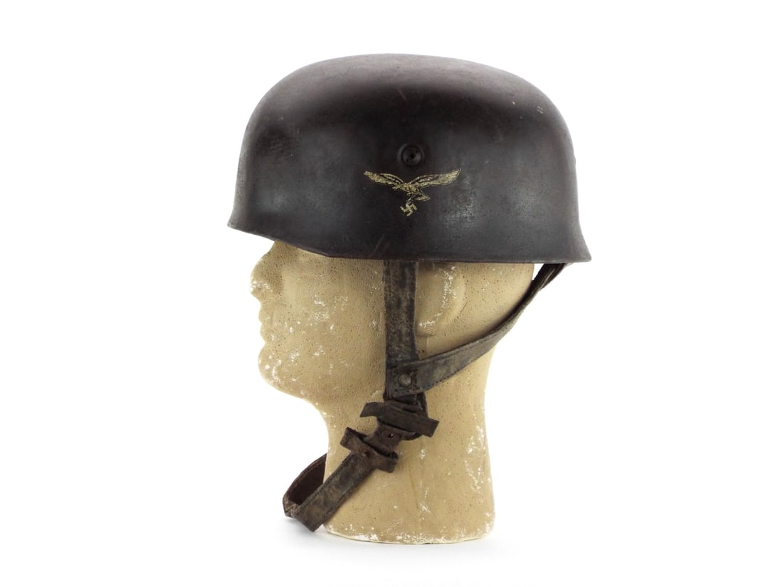 German Helmet in Style of WWII DOUBLE DECAL Paratrooper with Air Force Eagle: Steel shell exhibits textured dark finish with stable surface oxidation, displaying clear air force and tricolor decals with minor scuffing. Vented spanner bolts remain secure. Interior leather liner 