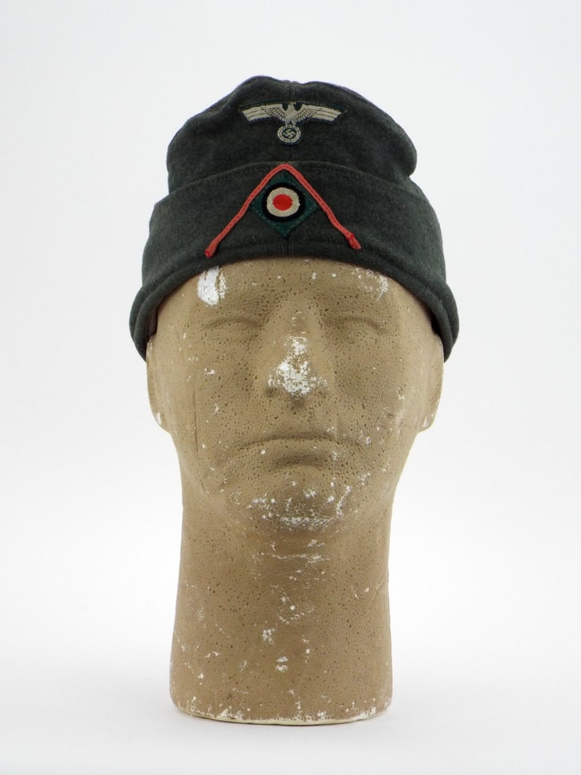 German Post WWII NCO Heer Panzer Field Cap: Field grey wool body shows honest service wear and mild handling patina with no major moth damage. Hand applied national eagle and tri color cockade insignia remain solidly attached over the distinct 