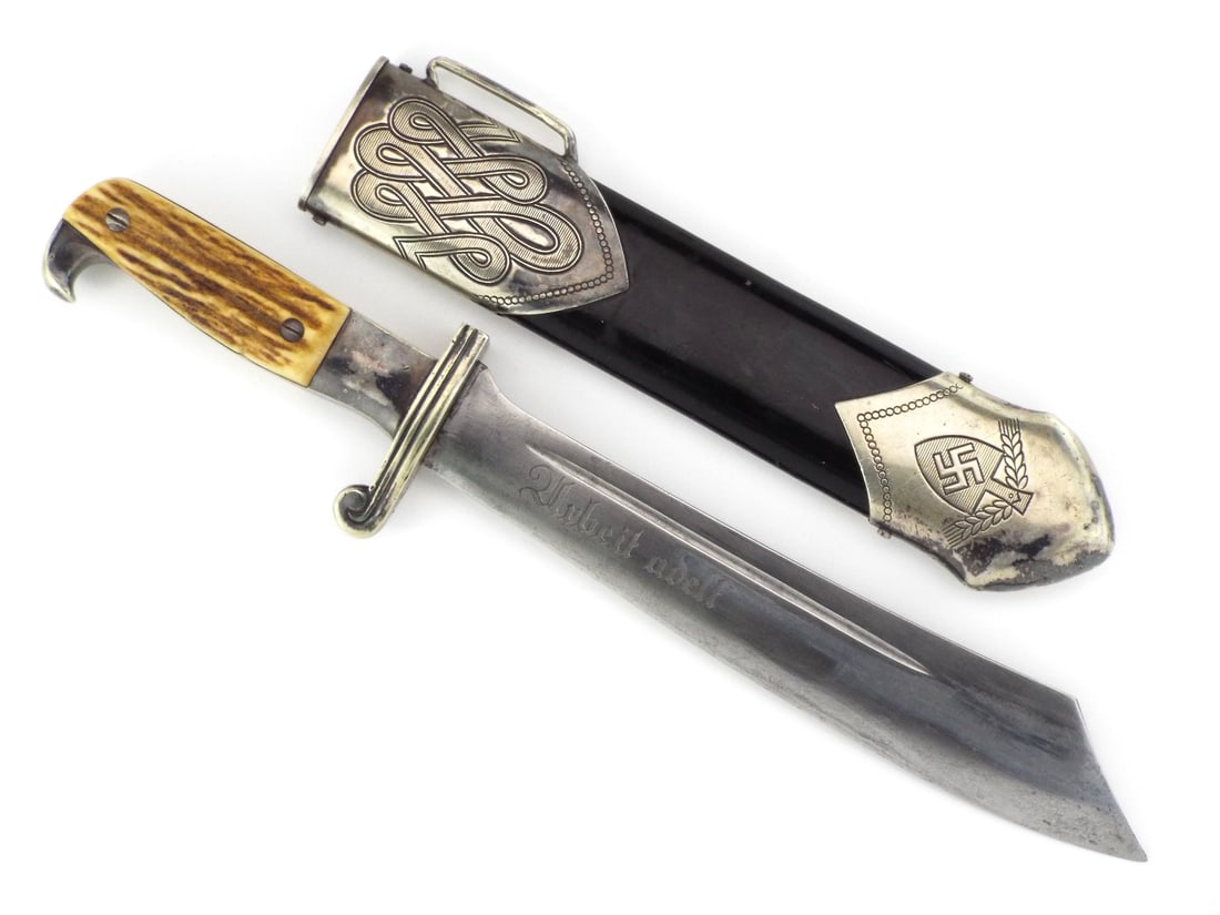 German WWII RAD Hewer By ED. WUSTHOF SOLINGEN with Stag Horn Grip: Thick single edged matte finish blade displays standard labor service etched motto, graying and surface oxidization. Nickeled crossguard with forward curved scroll shows thin plating at contact points