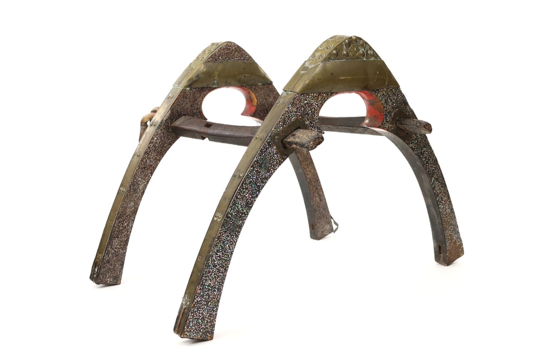 Chinese Qing Dynasty Military Saddle Frame BRASS & SHELL INLAY: Substantial wooden construction features sweeping arches displaying aged varnish and scattered surface wear. Heavy brass trim mounts the pommel and cantle, showing an unpolished patina, raised decorat