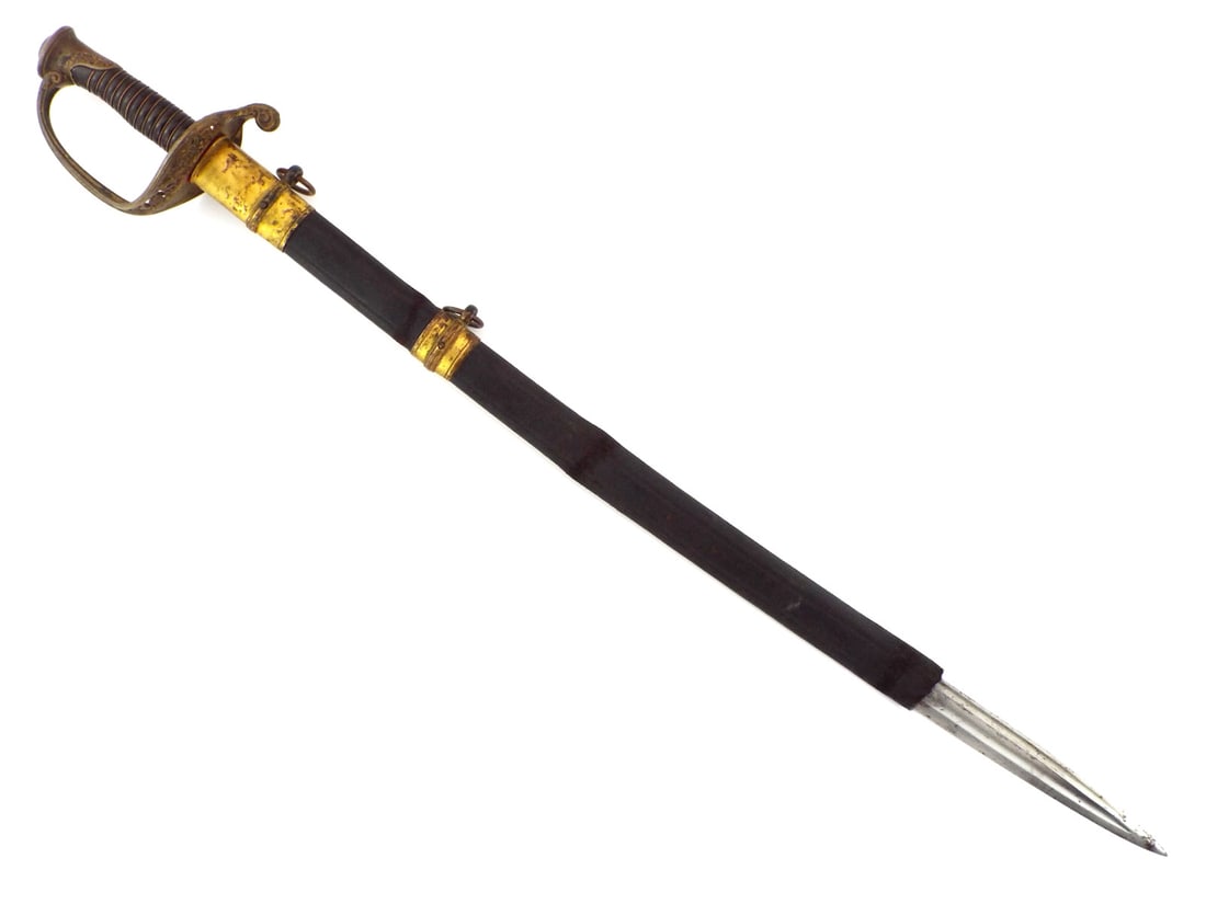 US Civil War Foot Officer Sword Cast Brass Hilt & PIERCED GUARD: Steel blade shows light surface graying, faint staining and a full length fuller. Cast brass guard features pierced floral openwork, ending in a rear curving scroll quillon with dark aged patina. Ribb