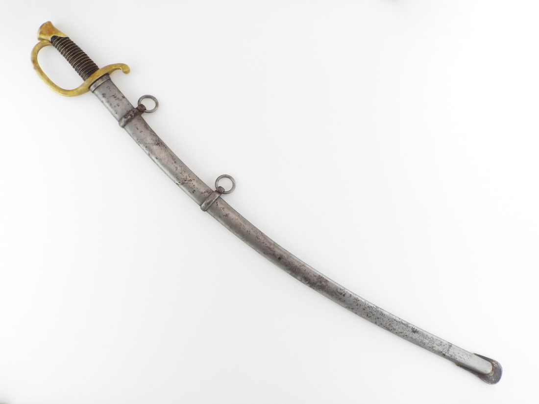 US Civil War Model 1840 MOUNTED ARTILLERY SWORD by AMES: Curved blade shows grey patina and light spotting with U.S., JH, and 1865 ricasso stamps. Brass D-guard hilt remains tight with a mellow tone. Leather grip wrap exhibits moderate surface wear and rema