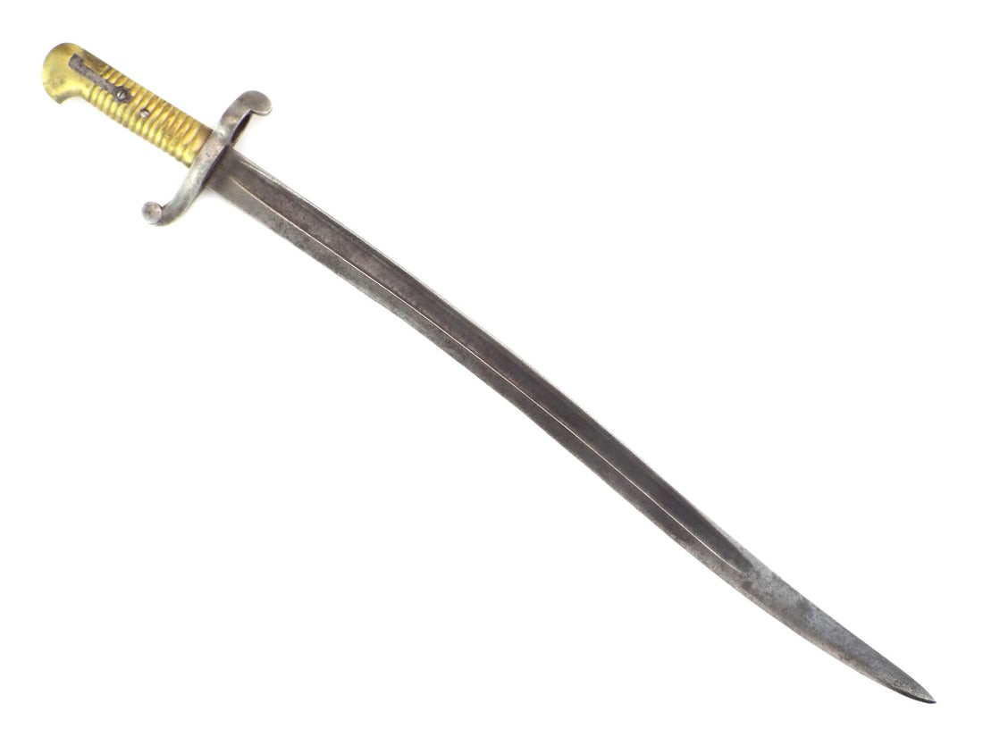 US Civil War RIFLE BAYONET with Yataghan Blade: Recurved steel blade shows dark oxidation throughout. The steel crossguard and muzzle ring exhibit age related wear. Solid brass ribbed grip remains tight with a functional leaf spring and locking lug