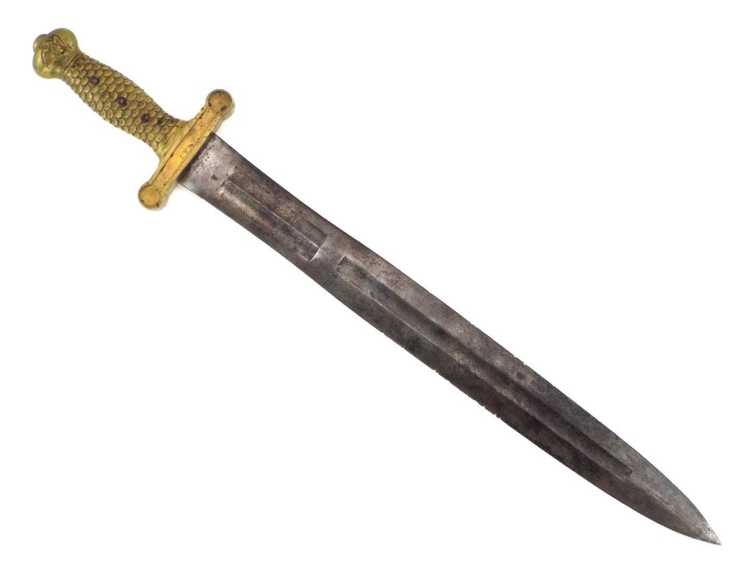 US Civil War Foot Artillery Sword By N.P. AMES SPRINGFIELD: Double edged blade displays heavy salt and pepper oxidation, localized spotting and multiple edge nicks with legible 1842 date and Joseph C. Bragg inspector stamps. The cast brass hilt exhibits an unc