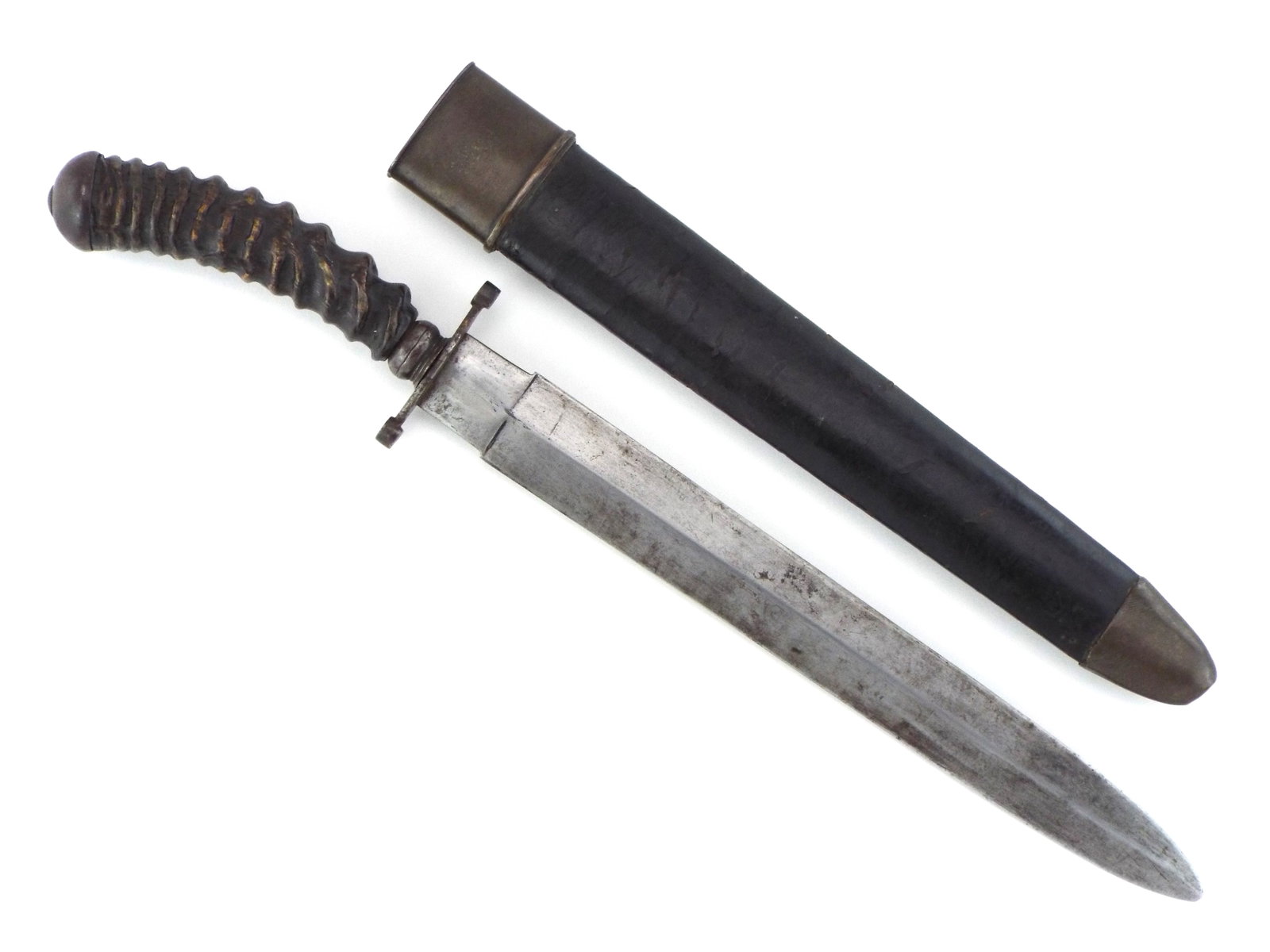 US Gold Rush Era Fighting Knife with HORN HILT: Straight double edged thrusting blade exhibits a strong medial ridge and minor spotting throughout. Cast steel crossguard features round concentric terminal quillons meeting a spirally carved dark hor