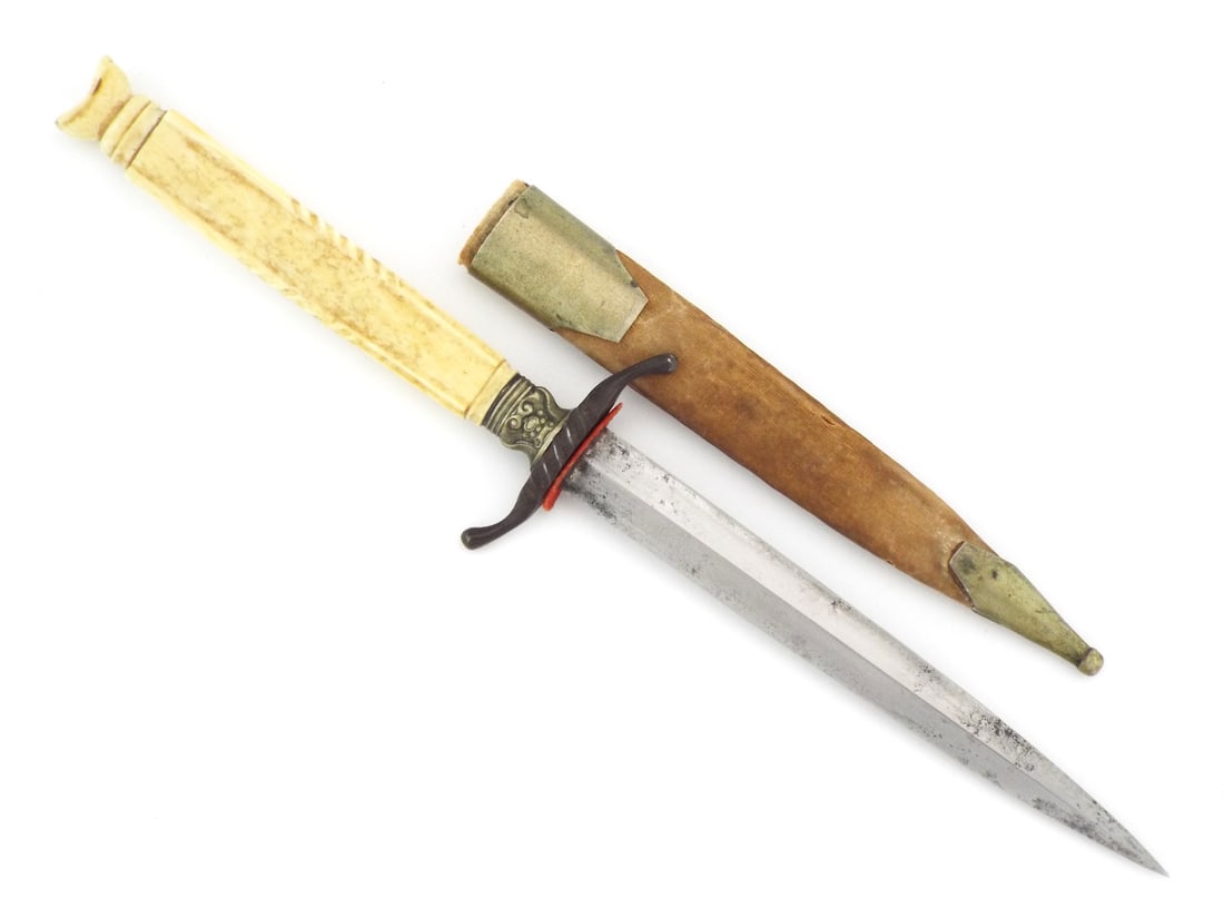 US Civil War Gambler Dagger with VERY FINE CARVED HILT: Double edged thrusting blade of diamond section displays stable grey patina and fine age darkening towards the tip. Steel crossguard with S-curved quillons shows age softened patina, mounted above a c