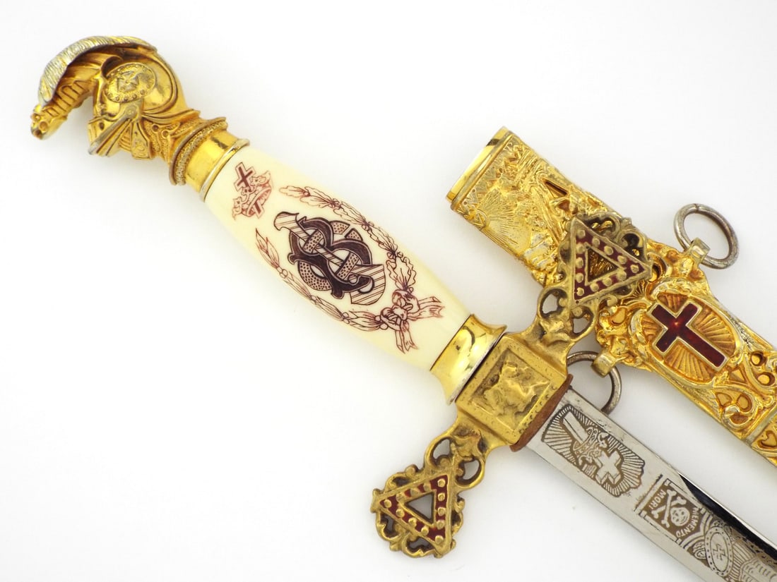 Named US Knights Templar Fraternal Sword By C.E. WARD CO. & Gilded Furnishings: Polished steel blade displays sharp acid etching featuring owner Charles J. Black, memento mori imagery, and maker mark with light oxidation near ricasso. Cream celluloid grip remains tight with red