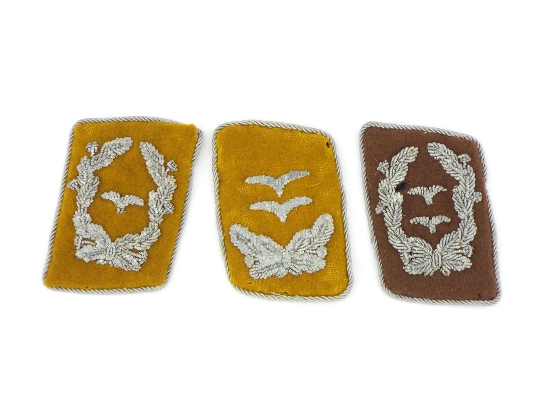 Trio of German WWII Luftwaffe Officer Collar Tabs FLIGHT CREW & SIGNAL: Trio of collar tabs displaying silver bullion wire hand embroidery on wool felt bases with twisted wire cord borders. Brown field shows light surface wear to nap, backing board exhibits age toning. Ye