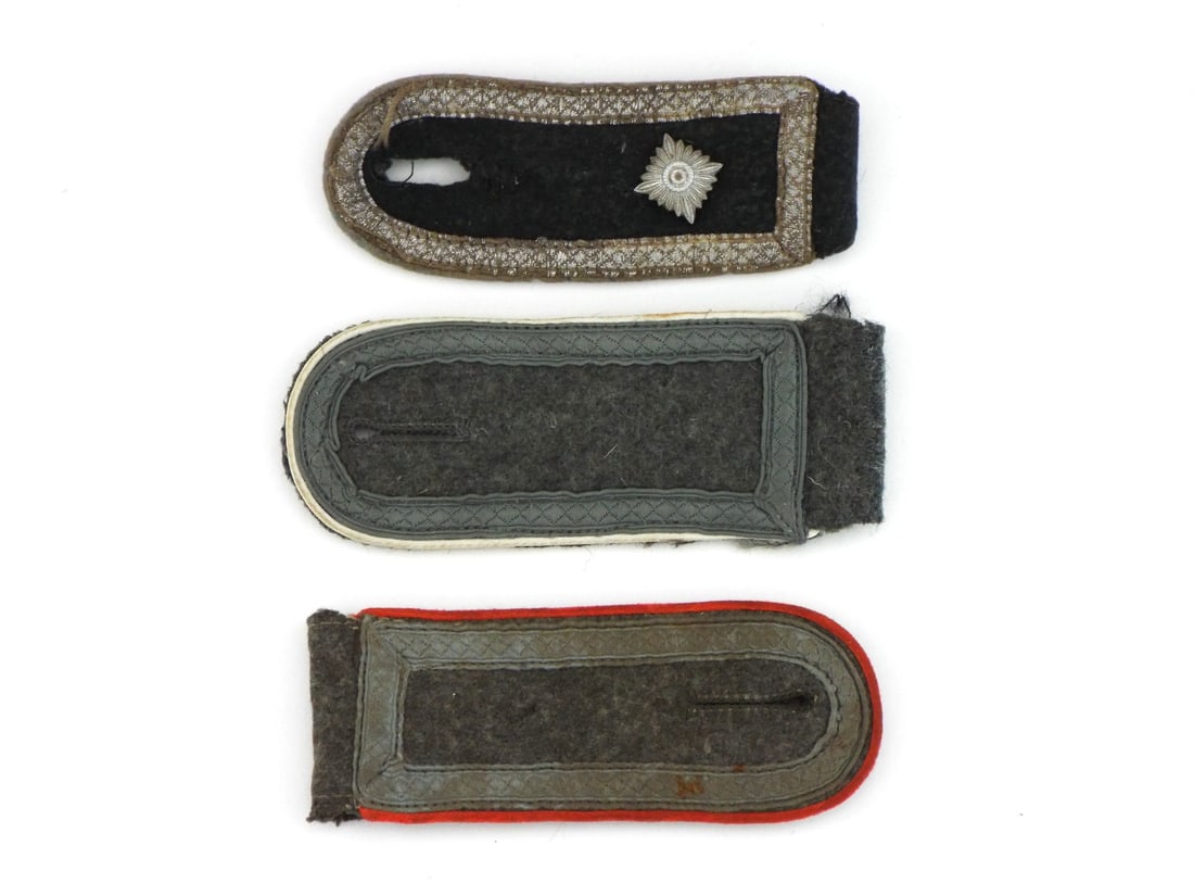 Trio of German WWII NCO SHOULDER BOARDS: German WWII trio of army non commissioned officer shoulder straps features wool body construction showing minor surface wear, age toning and field usage. The green strap displays early dark green badg