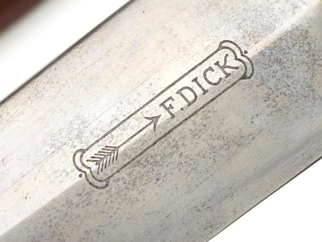 RARE MAKER German WWII SA Dagger By F. DICK: Double edged blade retains cross graining with etched inscription reading Everything for Germany and maker mark to ricasso, showing runner marks and light surface darkening. Rich wood grip features in
