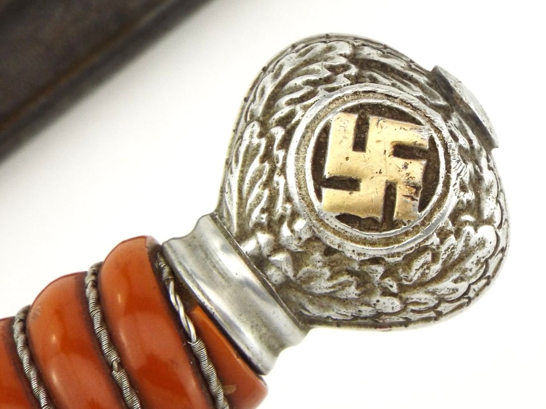 German WWII Luftwaffe Model 2 Officer Dagger By PUMA SOLINGEN With Knot: Double edged point blade exhibiting bright finish with light runner marks and light surface darkening, bearing stamped feline logo on ricasso. Cast silvered crossguard displaying luftwaffe emblem, per