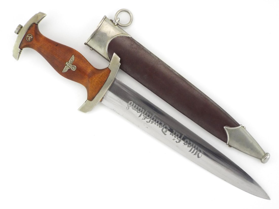 German WWII FACTORY GROUND ROHM SA Dagger E P & S SOLINGEN Blade: Early production double edged steel blade displaying heavy period grinding on the reverse from a mandatory Rohm inscription erasure, retaining a partial Ernst Pack & Sohne blacksmith maker mark. The b