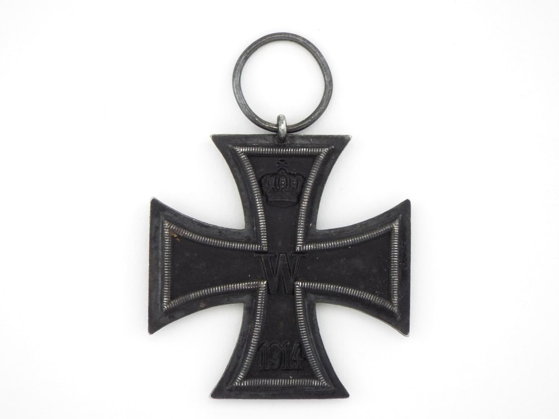 German Imperial WWI Iron Cross 2nd Class: Three piece constructed medal featuring a vaulted, magnetic black iron core set within a beaded silver frame displaying light age toning and high relief detail. Obverse core exhibits the crown, royal 