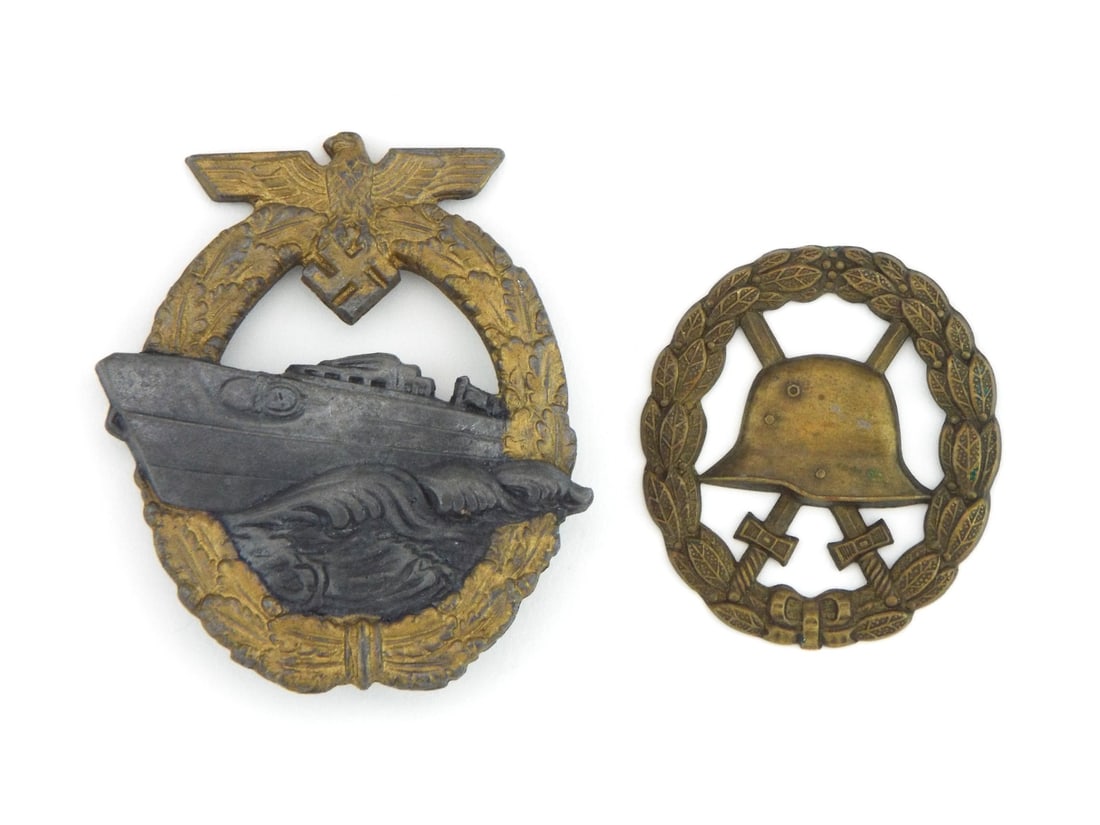 Pair of German WWI Wound Badge & WWII Fast Attack Boat Badge: German WWI Wound Badge paired with a Kriegsmarine Fast Attack Craft Badge. Wound Badge shows light surface wear on the helmet device with a mellowed finish across the stamped metal body. Fast Attack C