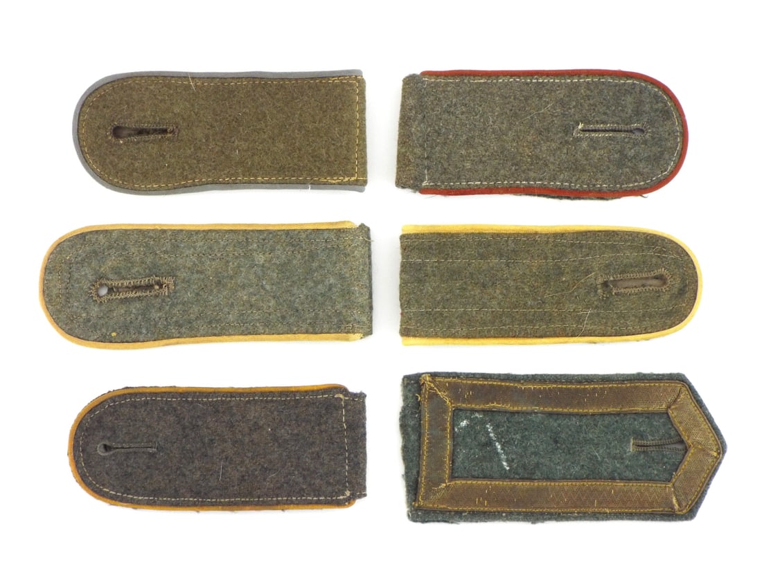 Lot of German WWII NCO Uniform Shoulder Boards: Lot includes coastal artillery, Luftwaffe field, army and artillery shoulder boards. Field grey wool body structures display light age toning, minor fiber fraying and stable cloth composition througho