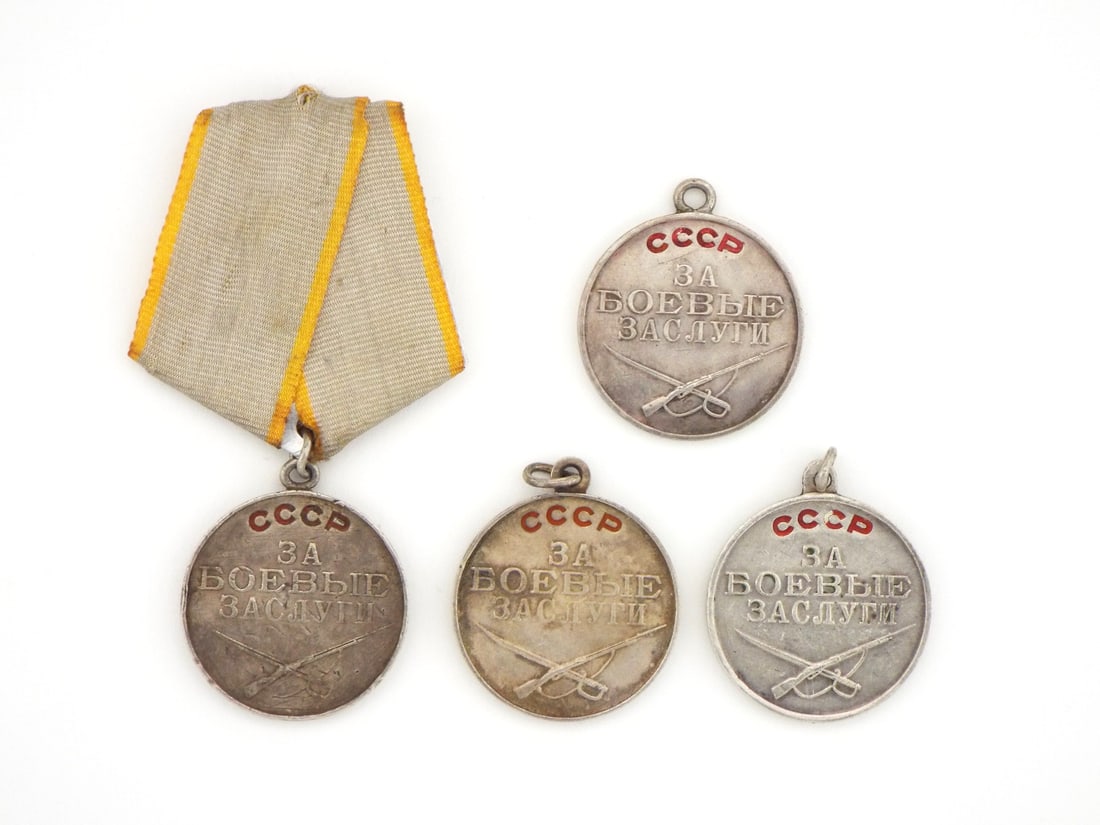 Soviet WWII Period Lot of 4 Medals For Battle Merit with Silver Enamel Work: Medal group displays silver disc bodies with red enamel filled inscriptions, showing age tone, surface wear and light handling marks, featuring stamped serial numbers to reverse, one is mounted on a p