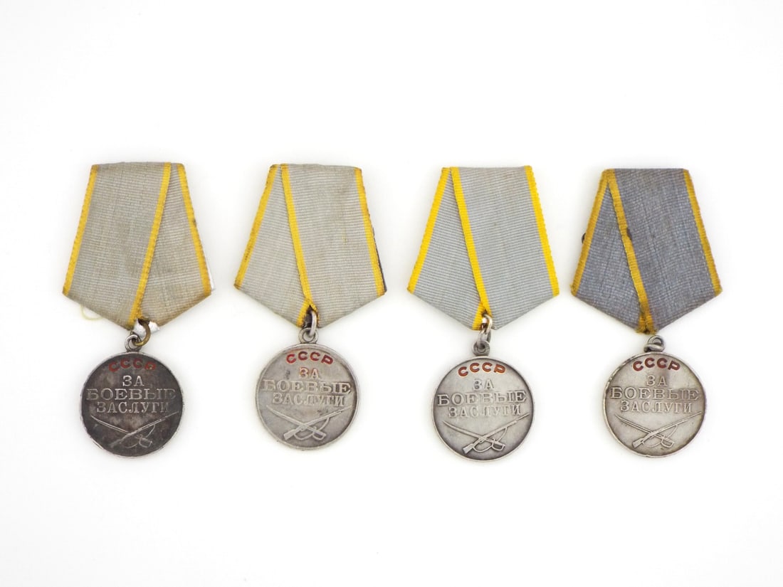 Soviet WWII Period COMBAT MERIT MEDALS Group of 4 SILVER Enamel: Four silver medals exhibit light surface wear, natural toning and dark age patina, with one reverse cleanly die stamped with serial number 1614263, all featuring intact red enamel on the obverse inscr