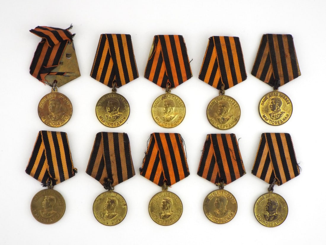 10 Soviet Post WWII Great Patriotic War MEDAL LOT Victory Over Germany: Group of ten brass planchets displaying portrait of Stalin and translated text Our Cause is Just We Won, obverse showing Victory Over Germany text, exhibiting light wear, toned patina, ribboned pentag