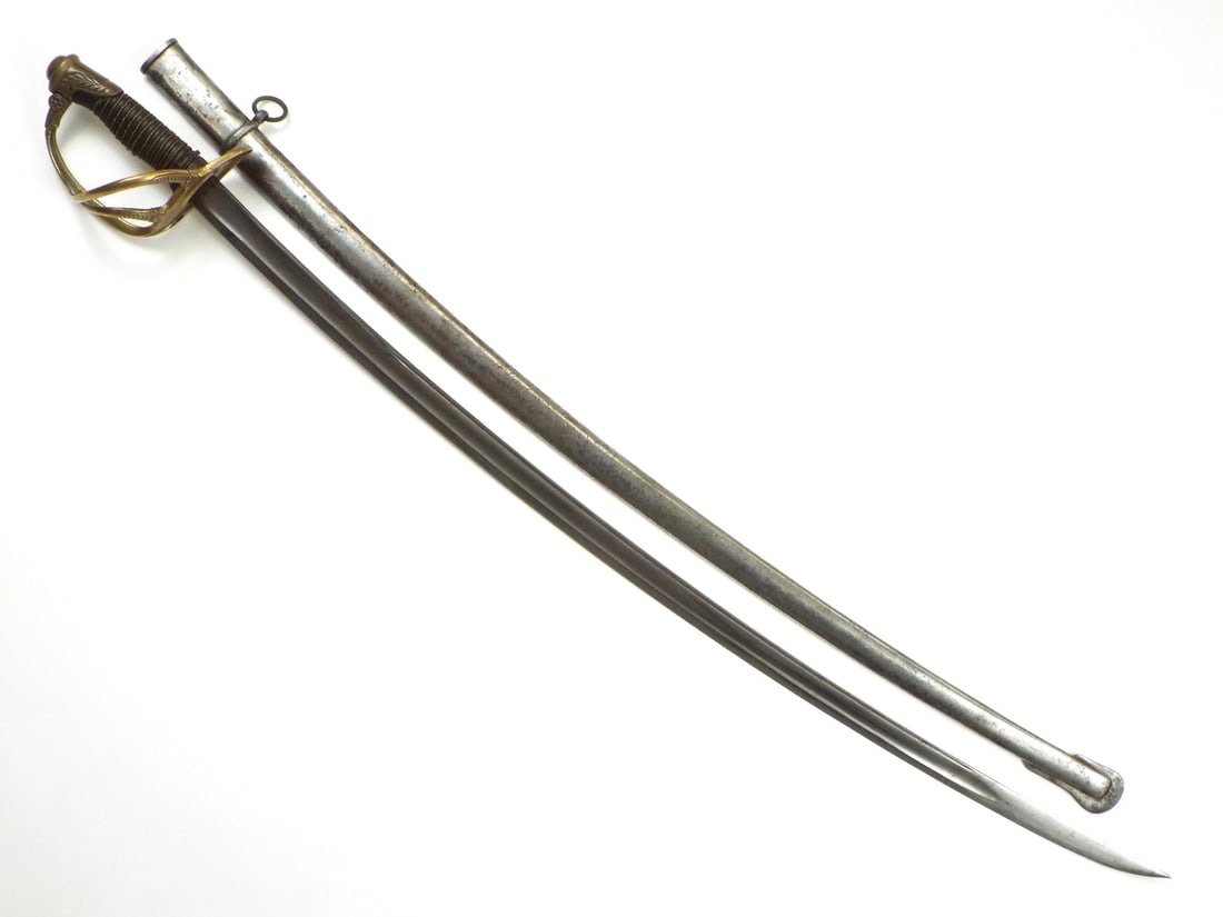 French WWI Artillery Officer Sword By MANUFACTURE DARMES DE CHATELLERAULT: Single edged steel blade with slight graying, minor oxidation and a clear spine inscription translated as Manufacture of arms of Chatellerault February 1903 Artillery Officer Model 1822-99. Three