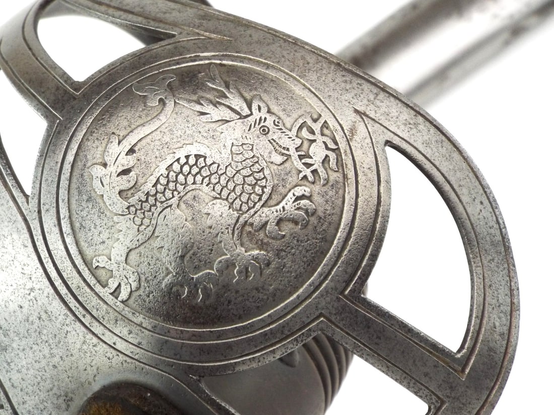 Very Rare German Colonial East Asian Expeditionary Corps Sword by HORSTER SOLINGEN: Straight pipe back blade shows scattered surface patina with E & F HORSTER SOLINGEN maker mark at ricasso. Brass finished steel guard features openwork Chinese Imperial dragon motif with mild
