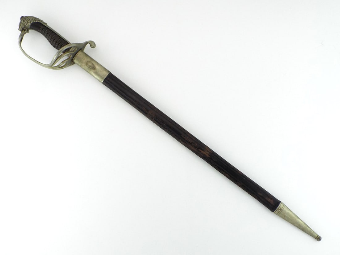 Belgian Late 19th C. Police Commissioner Sword By AUGUSTE FONSON with Brass Lion Head Pommel: Fullered blade displays grey patina and wear, stamped Auguste Fonson Brussels. Multi bar brass guard is solid, stamped C 103, with wire wrapped horn grip and lion head pommel. Flaking leather