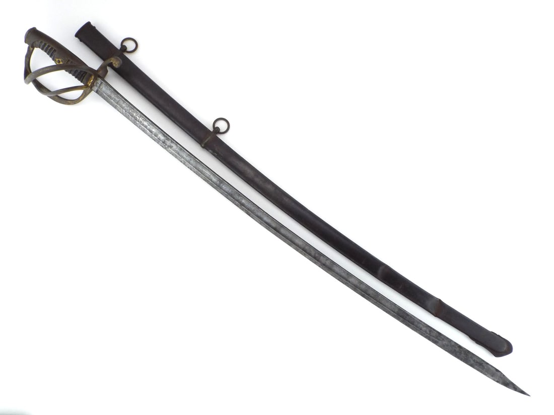 German Imperial WWI Private Purchase EICKHORN Cavalry Sword Etched Blade: Lightly curved single edged blade shows light spotting, fine double fullers, intricate floral etching with panoply of arms along both faces, leaf etched spine and squirrel hallmark stamped at