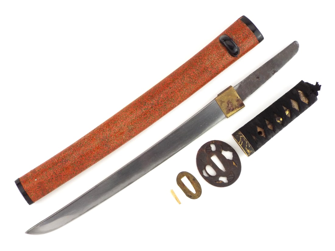 Japanese Edo Period Wakizashi Short Sword with Sukashi Iron Tsuba: Unsigned single edged steel blade displaying a faint wavy temper line with mild surface graying and light runner marks along the flats, featuring a single peg hole on the unpolished tang. The shagreen