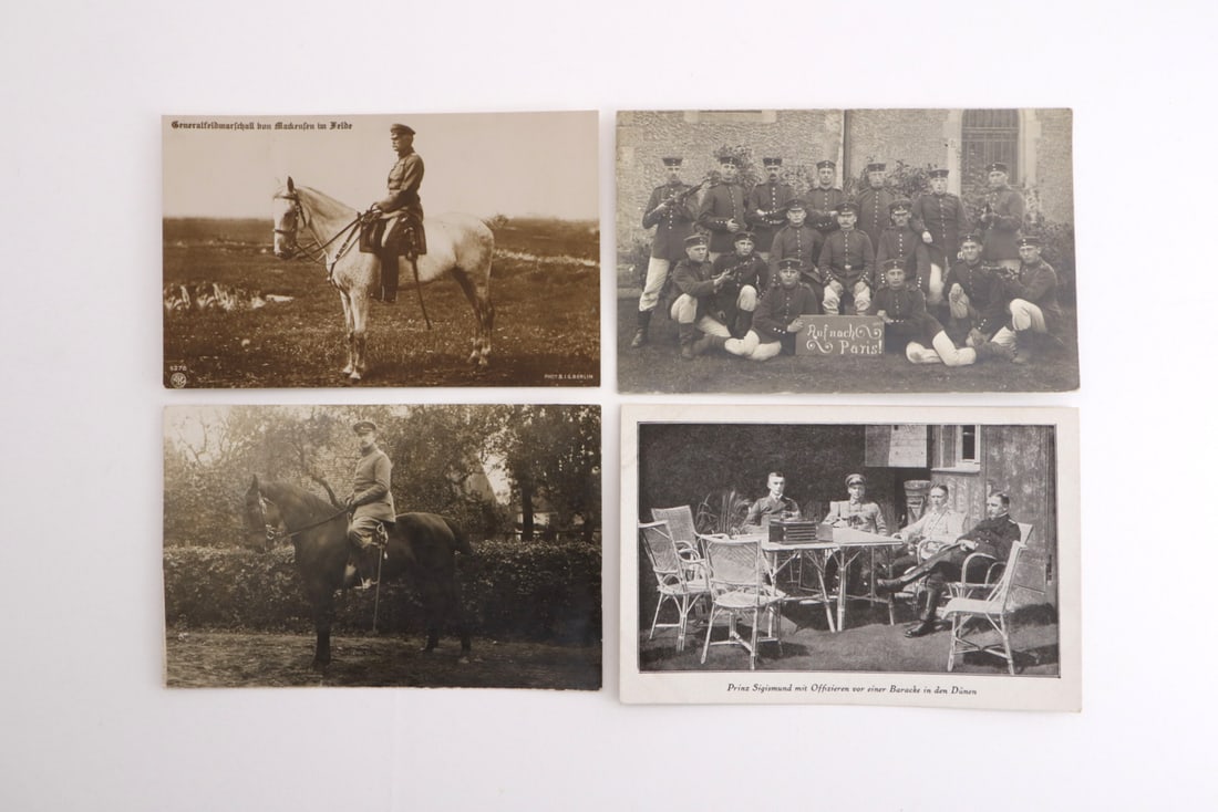 German WWI Feldpost Card Lot Mackensen & Imperial Military Officers: Lot of four photo postcards featuring Field Marshal von Mackensen, troop formations inscribed On to Paris!, officer portraits and Prince Sigismund in dunes, showing light corner wear, toning, silverin