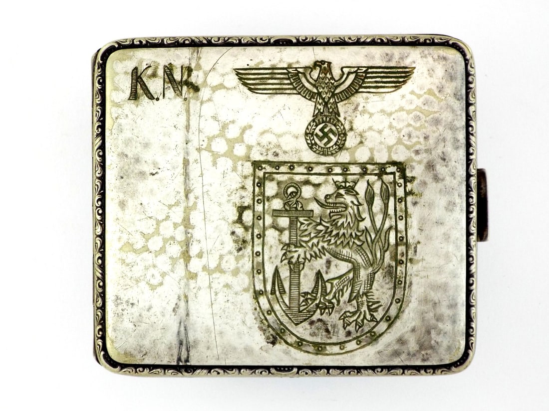 German WWII U-Boat Cigarette Case Dusseldorf Lion & 800 SILVER: Engraved silvered body displays an eagle above a Dusseldorf coat of arms with hand cut monogram initials, reversing to a commemorative Soviet bomber and submarine engraving dated October 31, 1944. Sur