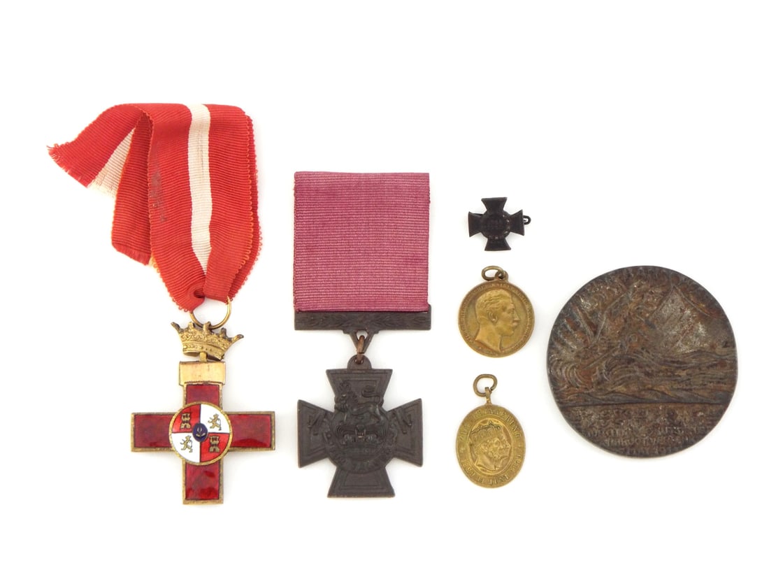 Lot of WWII Era Mixed European Medals: Group of medals and decorations comprising a Spanish Cross of Naval Merit with red enamel facing and crowned suspension showing light surface wear, a post WWII British Victoria Cross in dark patinated
