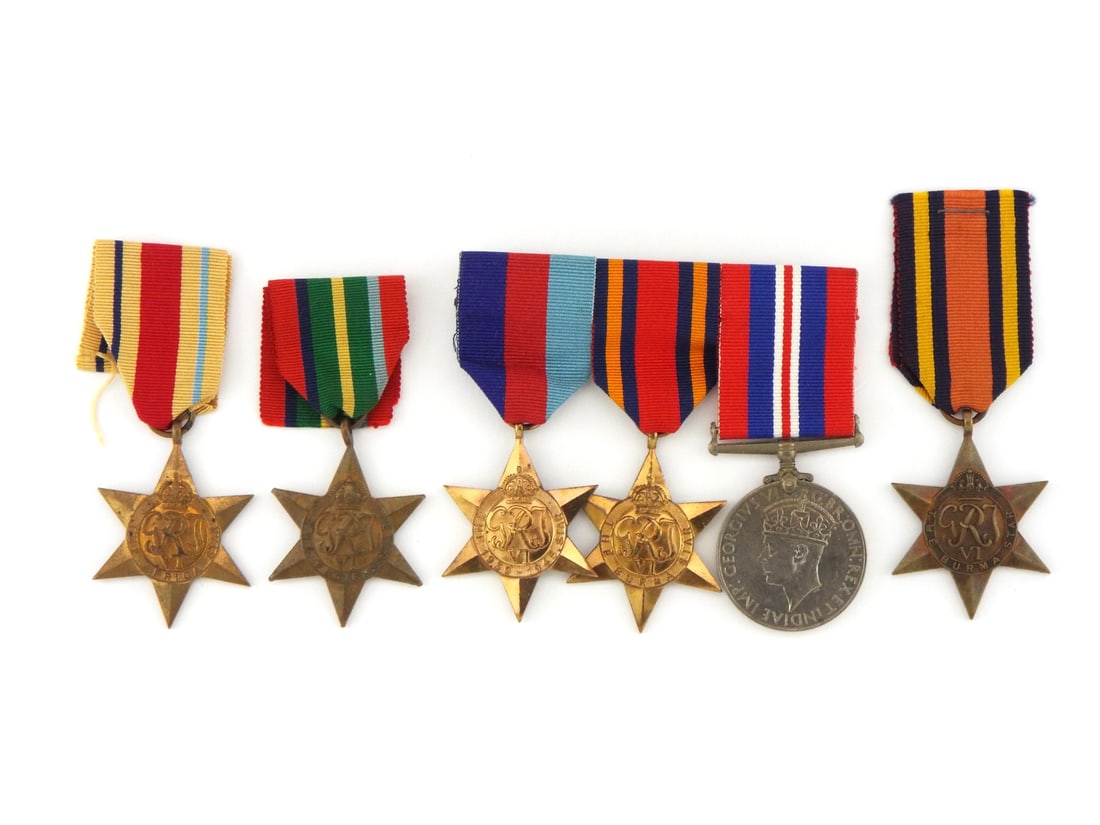 British WWII Group of CAMPAIGN MEDALS & Stars: British Commonwealth six pointed bronze campaign stars displaying central GRI VI cyphers beneath crowns, showing aged surface toning, minor edge wear and honest patina across rays and planchet fields.
