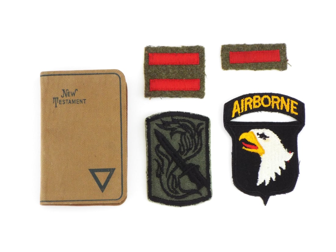 US Vietnam War 101st Airborne & 199th Brigade Patch Grouping & BIBLE: Lot includes color embroidered 101st Airborne Division shoulder insignia with separate curved Airborne tab, alongside a olive drab green and black subdued 199th Infantry Brigade flaming sword patch di