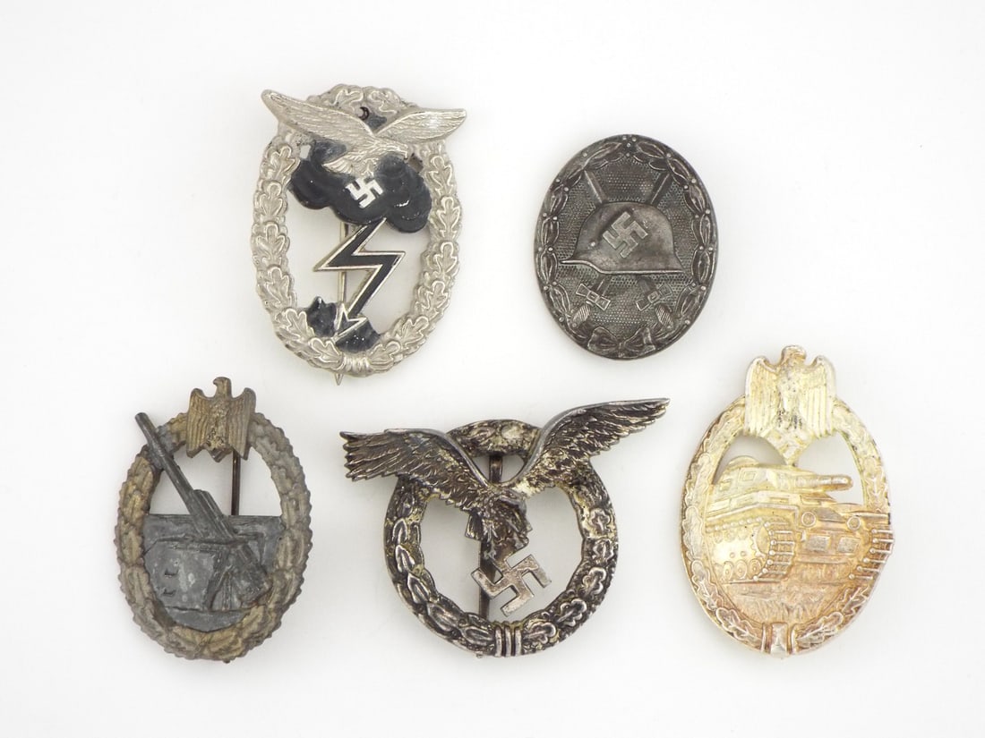 Group of German POST WWII Combat & Qualification Badges: Grouping of combat badges including Luftwaffe Ground Assault, Wound, Flak, Aircrew and Panzer Assault examples, exhibiting light to moderate surface wear, intact reverse pin assemblies with dark aged 