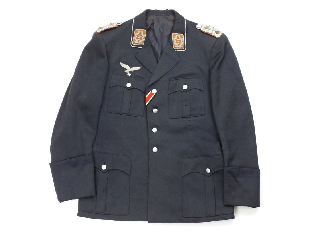 German WWII Luftwaffe AIRCREW TUNIC with Iron Cross Ribbon & Silver Bullion Insignia: Luftwaffe four pocket service tunic constructed of dark blue grey wool displaying light overall wear, fine silver wire hand embroidered breast eagle and matching yellow backed collar tabs piped in twi