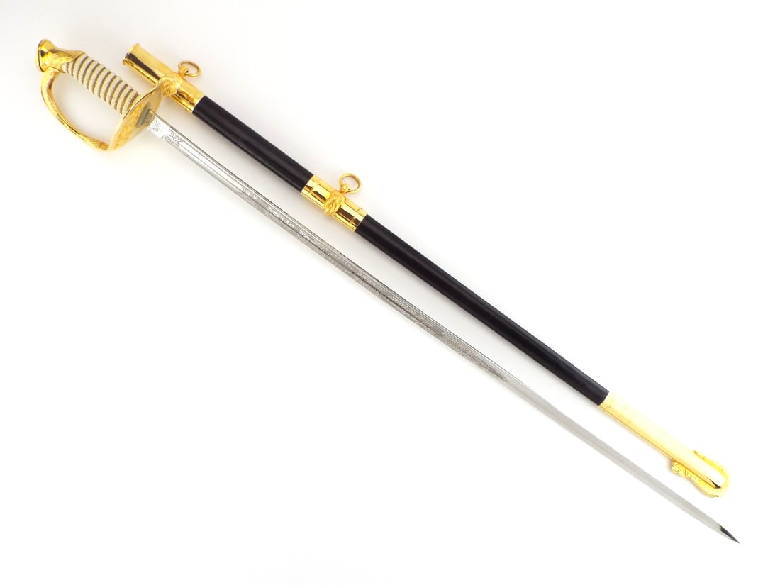 US Post WWII Navy Officer Dress Sword Gold Plated Mounts GERMAN BLADE: Single edged stainless steel blade features fullers, etched floral scrolls, naval motifs, six pointed star proof mark and Zubco Germany maker mark at ricasso showing light surface handling wear. Gilt 