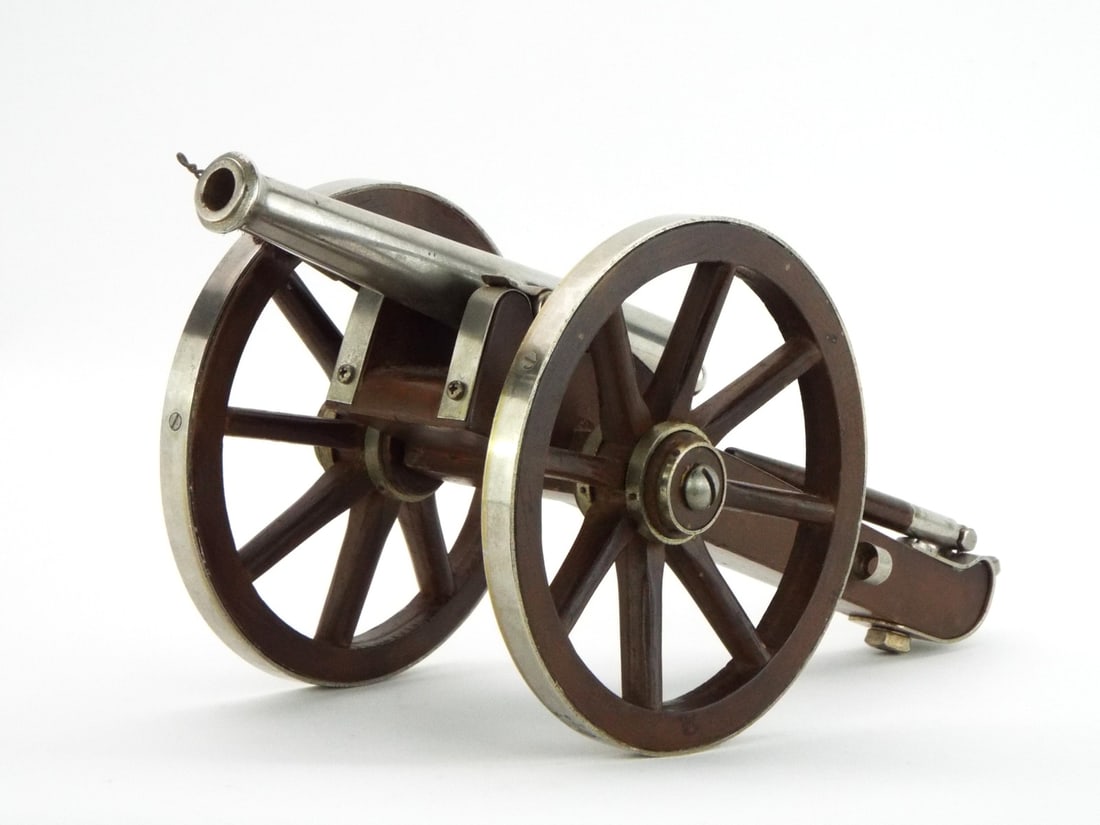 American Mid 20th C. Miniature Cannon PARKEMY INC. Plated Barrel & Hardwood Carriage: Machined chromed steel barrel showing light age toning, top stamped PARKEMY INC. MIAMI-FLA., fitted with a touchhole and rear elevation screw. Mounted on a solid hardwood field carriage featuring meta