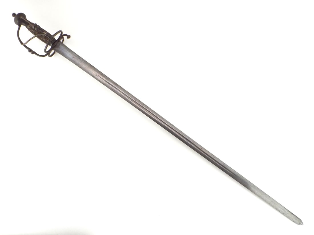 Unusual European 17th C. Walloon Sword DAMASCUS BLADE & Wire Hilt: Damascus double edged broadsword blade shows watered steel figure, faint central fuller, light staining and mild scattered surface graying. Iron hilt features twin shell guards with protective outer b