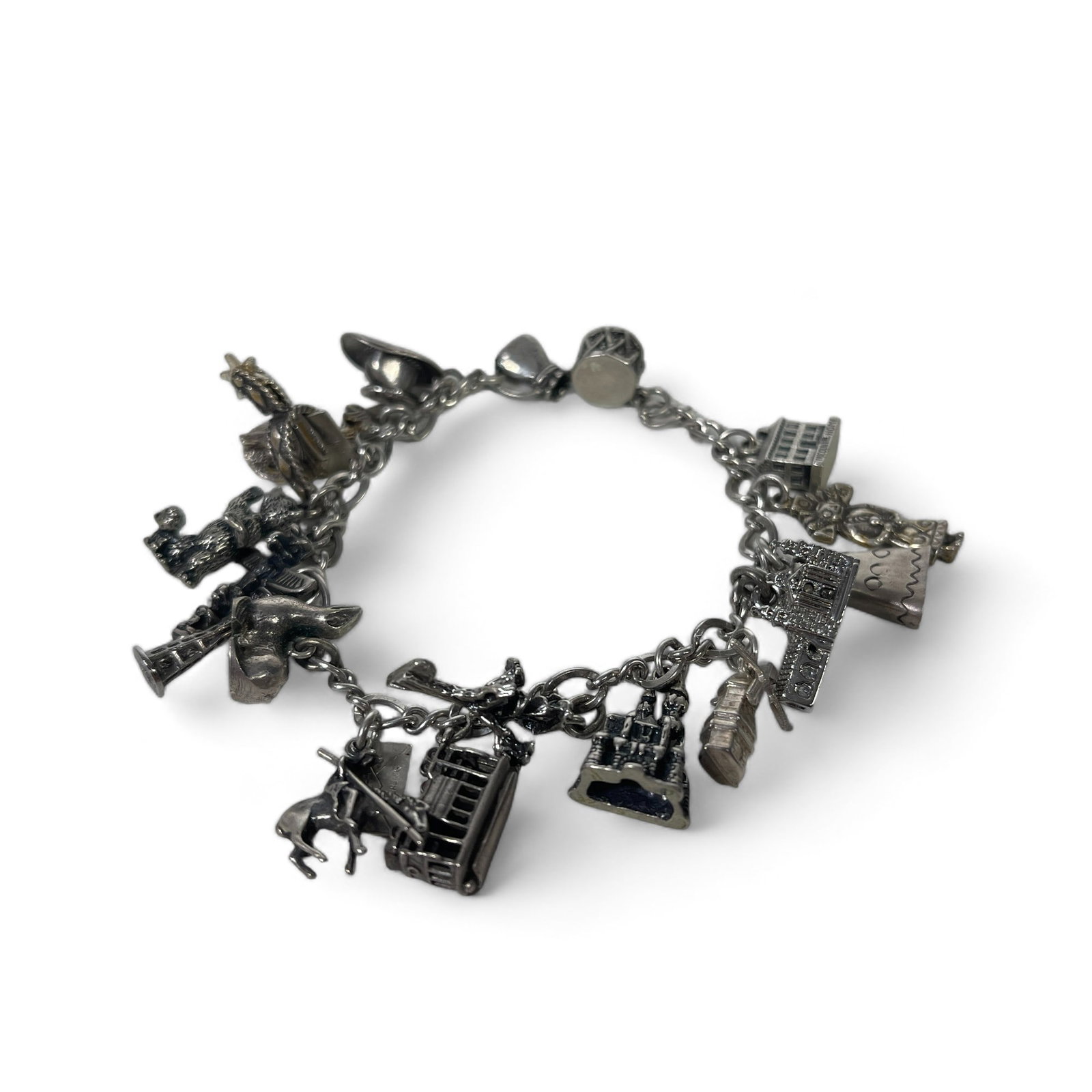 Vintage London Sterling Silver Charm Bracelet: Measures 7 1/2" wide, weighs 54.8 grams.