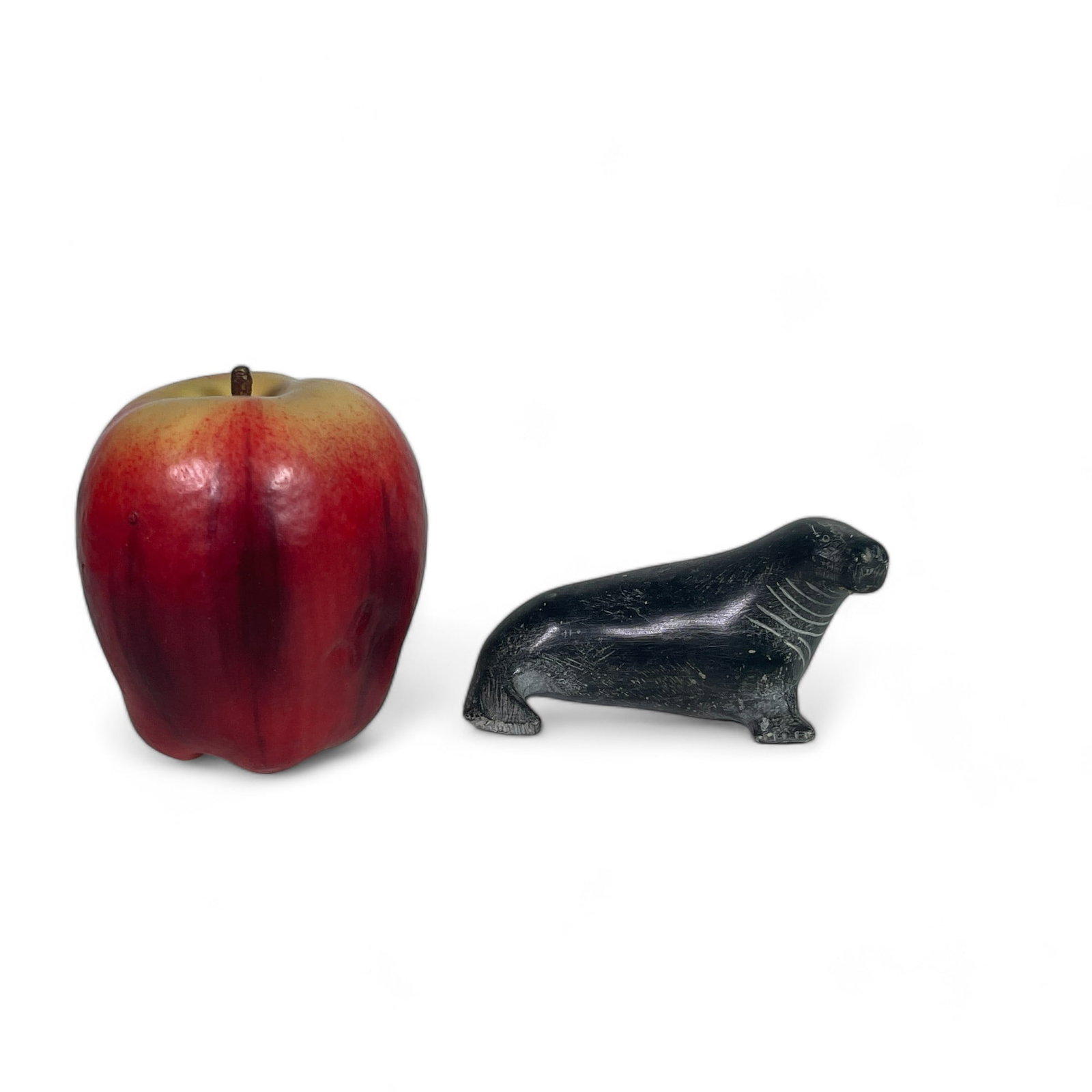Inuit Carving of a Seal: Measures 3 7/8" wide, 2 1/2" deep, 2" tall.