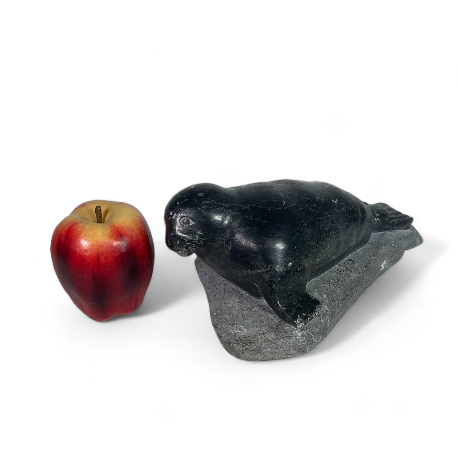 Inuit Carving of a Seal: Measures 11" wide, 6 1/2" deep, 4 1/4" tall.