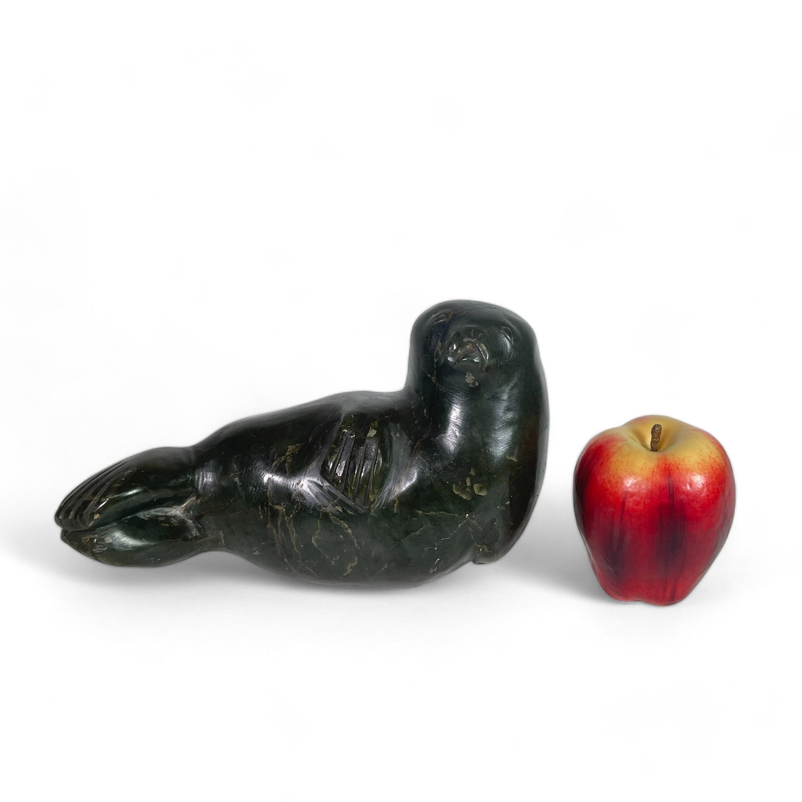 Inuit Carving of a Seal: Measures 9 3/4" wide, 4 1/2" deep, 5 1/2" tall.