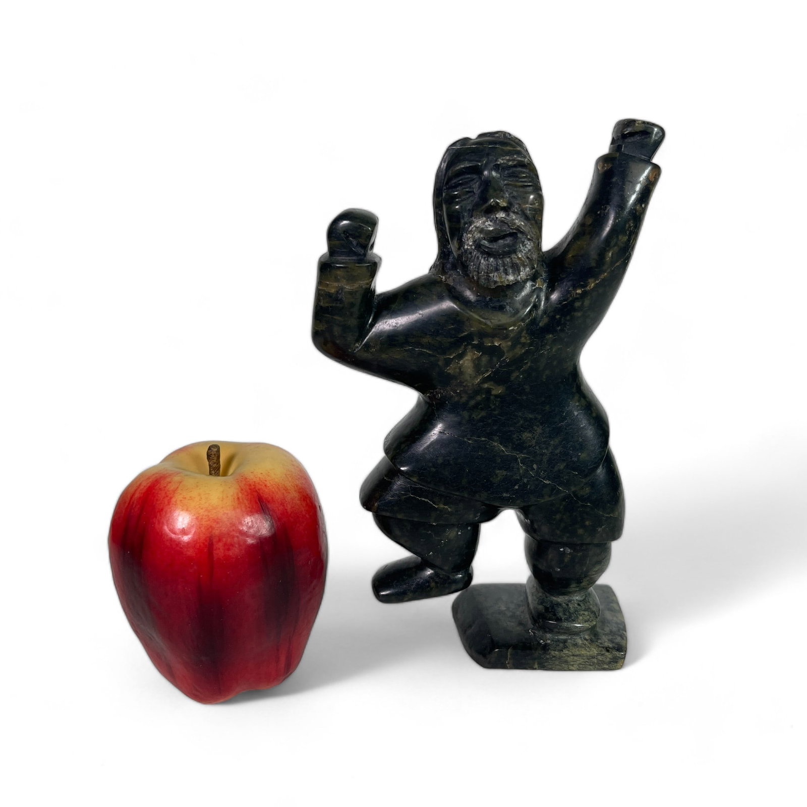 Inuit Carving of a Man: Measures 4 3/4" wide, 2 1/2" deep, 7 1/2" tall.