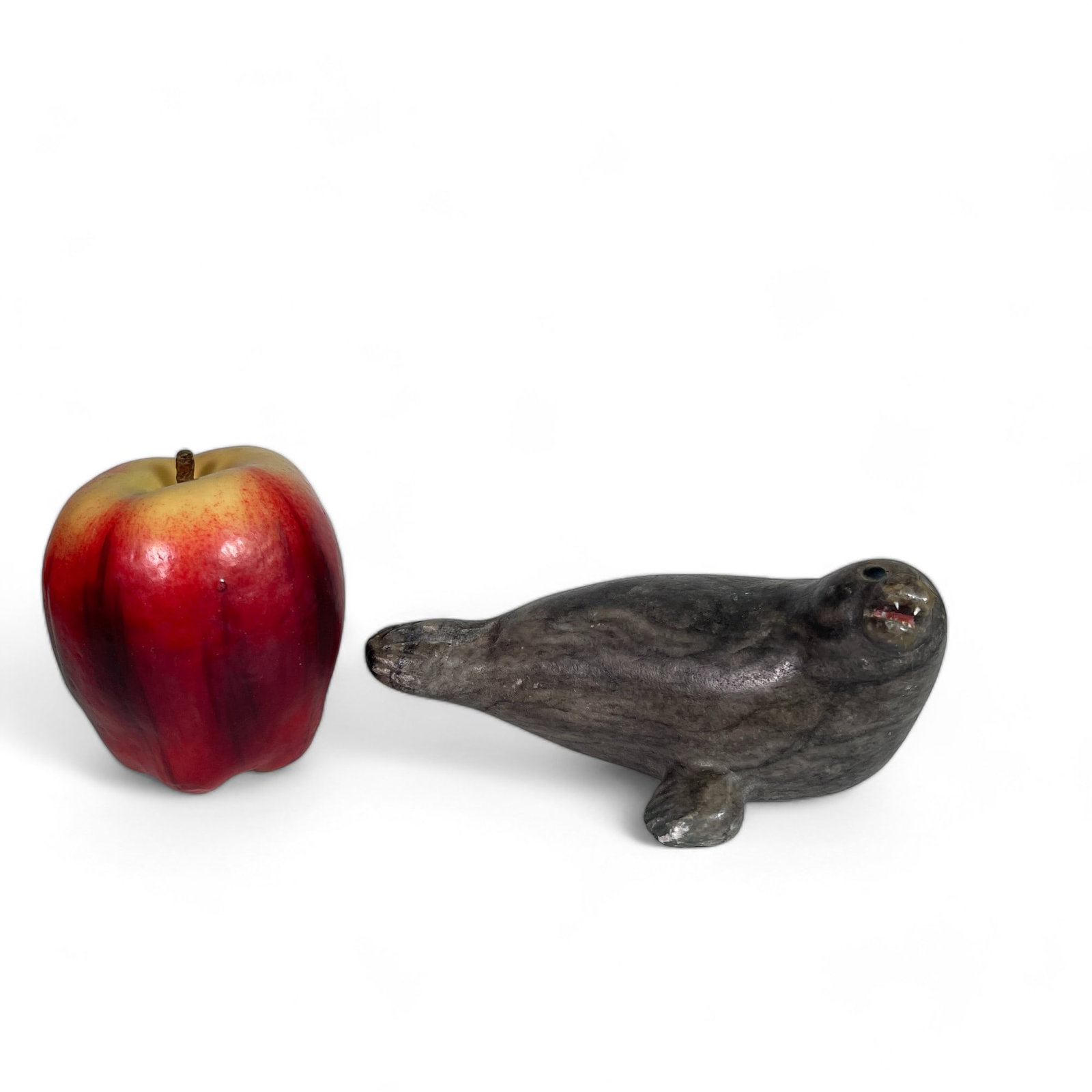 Inuit Carving of a Seal: Measures 6" wide, 3 1/2" deep, 2 3/4" tall.