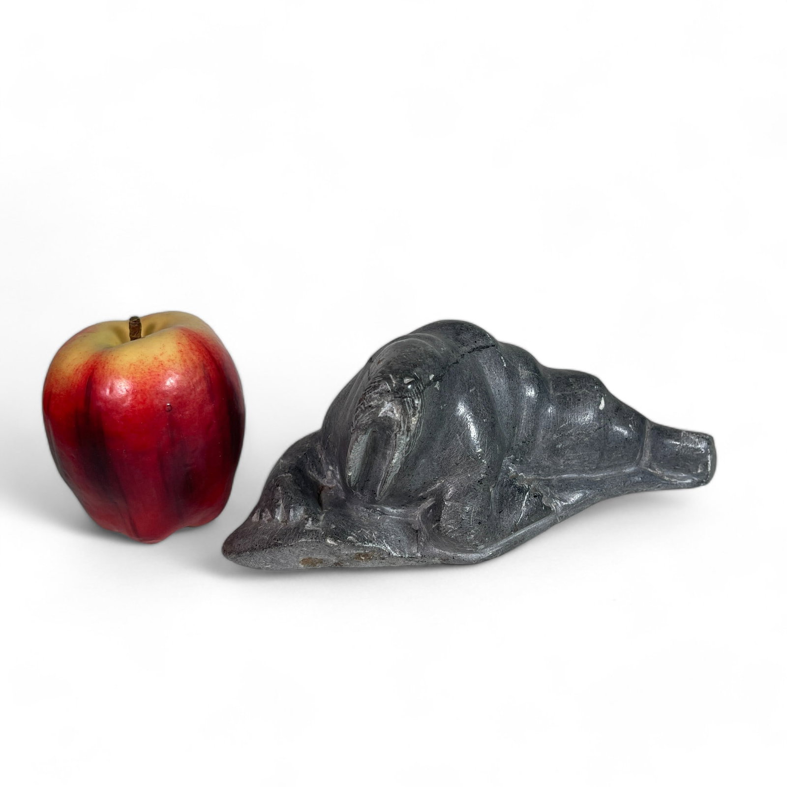 Inuit Carving of a Walrus: Measures 8 3/4" wide, 4" deep, 3 1/8" tall.