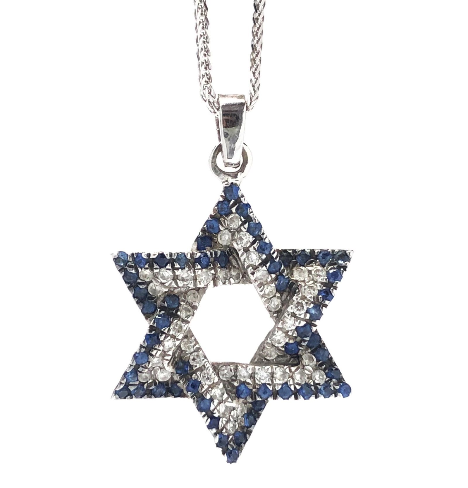 A 14K Gold "Magen David", which is embedded about 0.40ct natural white diamonds along with about: A 14K Gold "Magen David", which is embedded about 0.40ct natural white diamonds along with about 0.70ct Sapphire Stones, the pendant is 14k and accompanied by a 55 cm gold chain - pendant height inclu