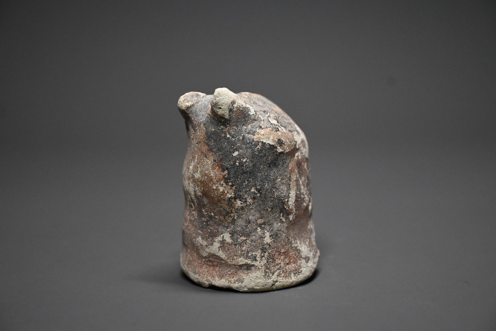 An persian nishapur chess piece: A Rare Early Islamic Terracotta Chess Piece (Bishop/Shatranj Piece)Eastern Iran, probably Nishapur, 9th–12th century CESize: 6cm height x 4cm.Modeled in terracotta with a tapering abstract form surm