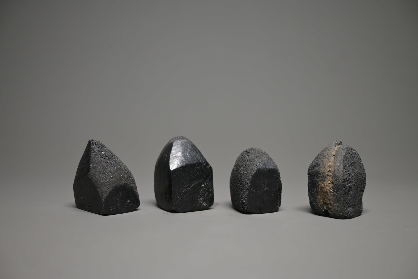 4 jet games pieces, early islamic: 4 Rare jet gaming pieces, probably a chess pawn (baidaq), Islamic world, circa 8th–9th century CE. 3cm tall