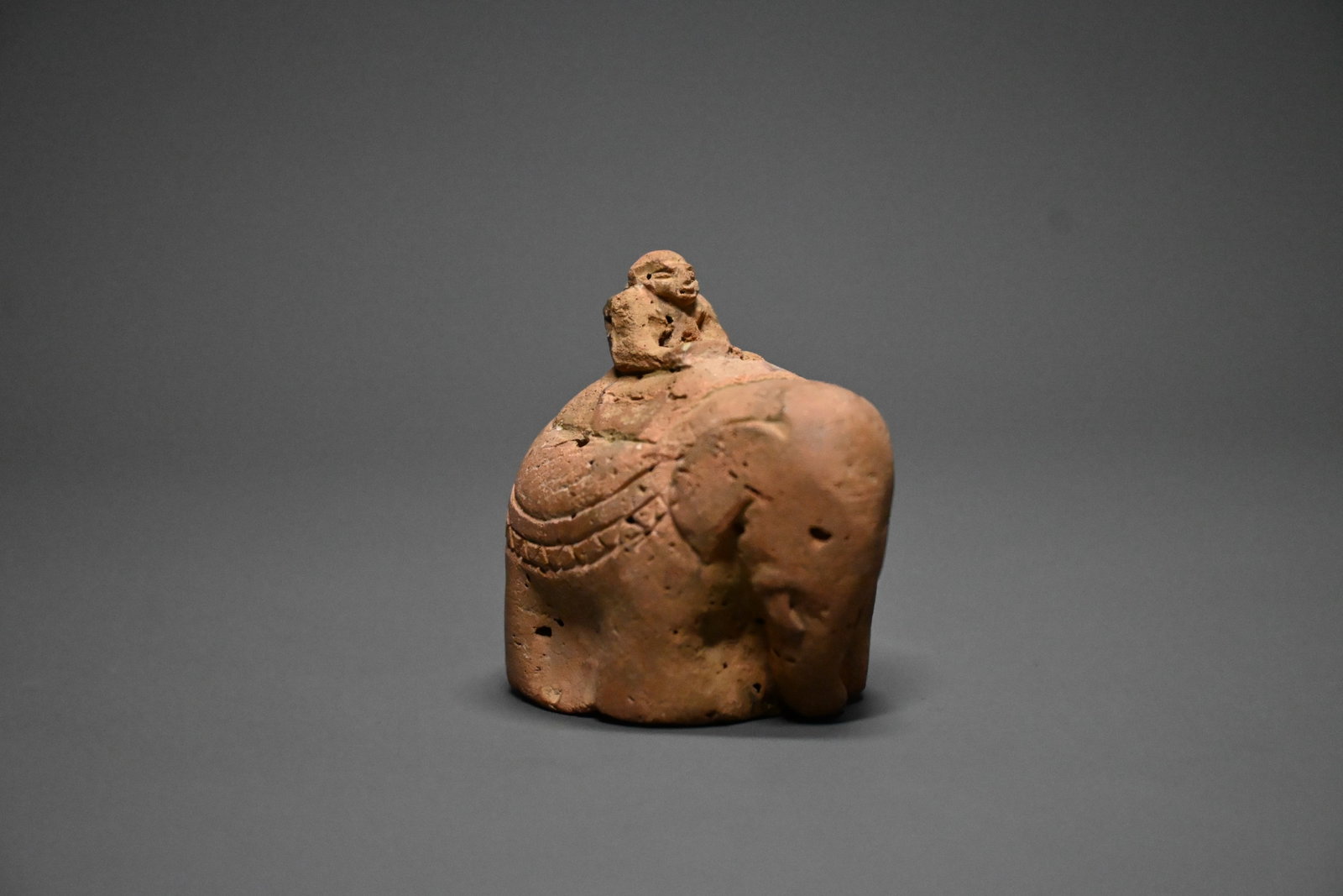 Early Islamic terracotta chess piece depicting an elephant (fil): Rare Early Islamic terracotta chess piece depicting an elephant (fil), circa 7th–8th century CE. Modelled in a stylized sculptural form with a rider seated on top.5.5cm height x 5cm